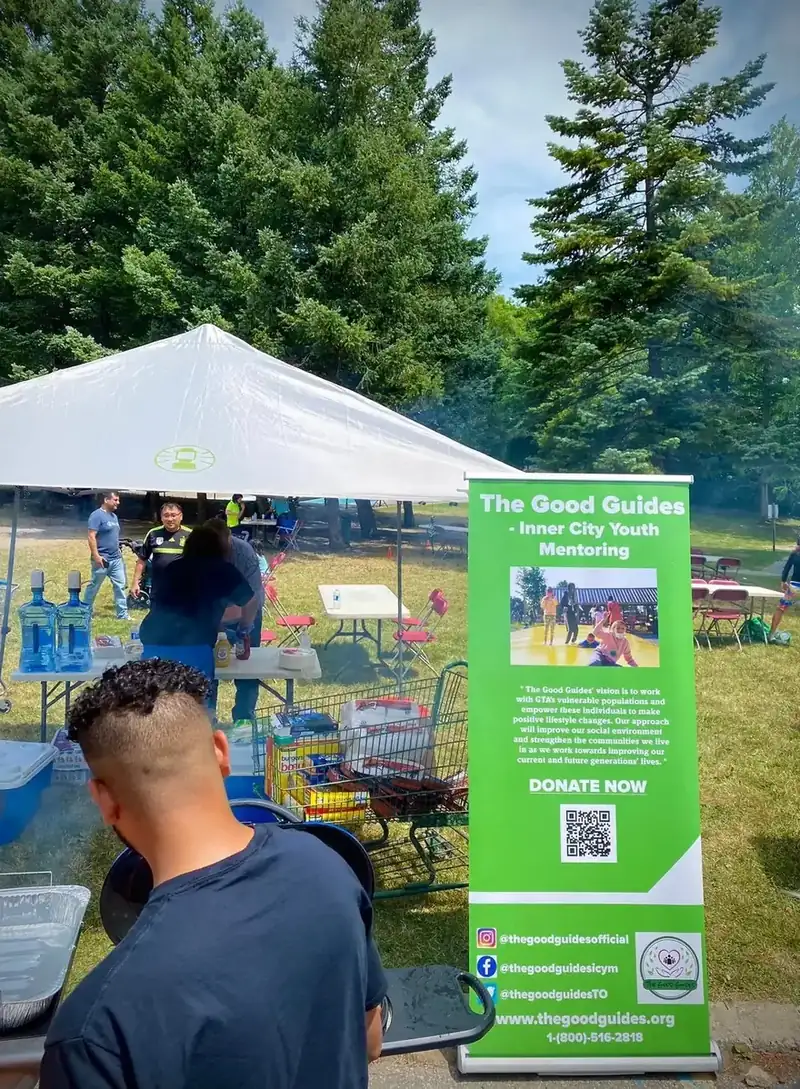 The Good Guides banner and event tent at Funday With Cops in a Scarborough school park