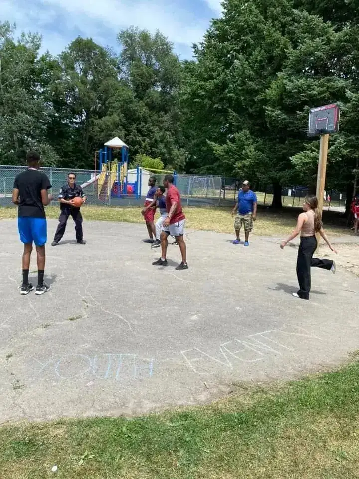 Families and community members at the Funday With Cops school park event