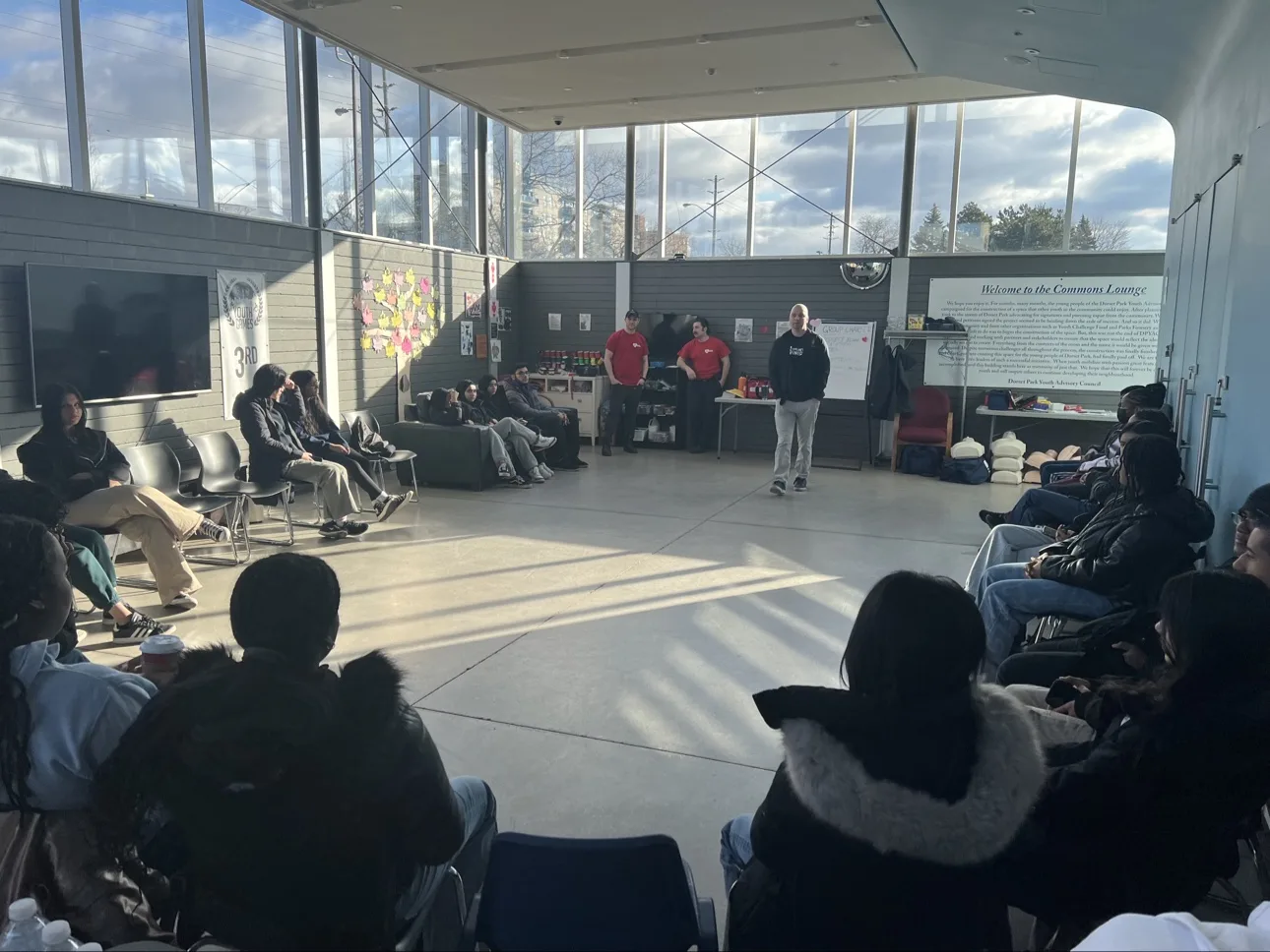 Young people and mentors in a mentoring circle during a Good Guides session in Scarborough