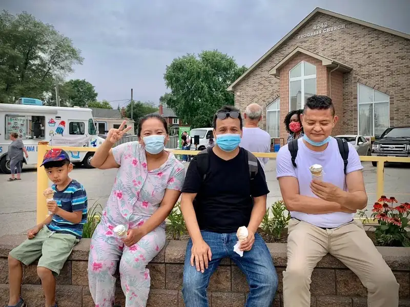 A community family connecting with The Good Guides at a neighbourhood event in Scarborough